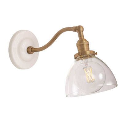 Grace Sconce shown in Heirloom Brass with a Gloss White Ceramic canopy and Clear Glass shade