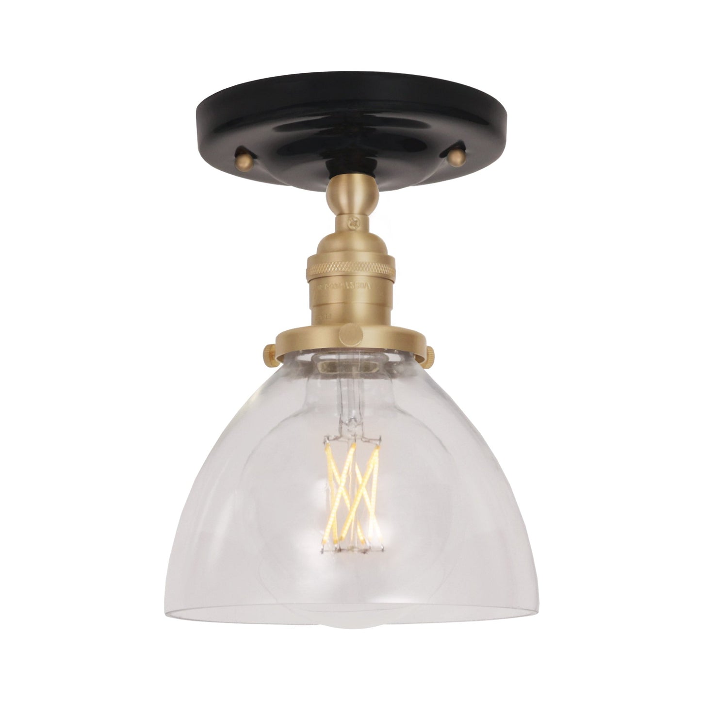 Grace Surface shown in Brass with a Gloss Black Ceramic canopy and Clear Glass shade