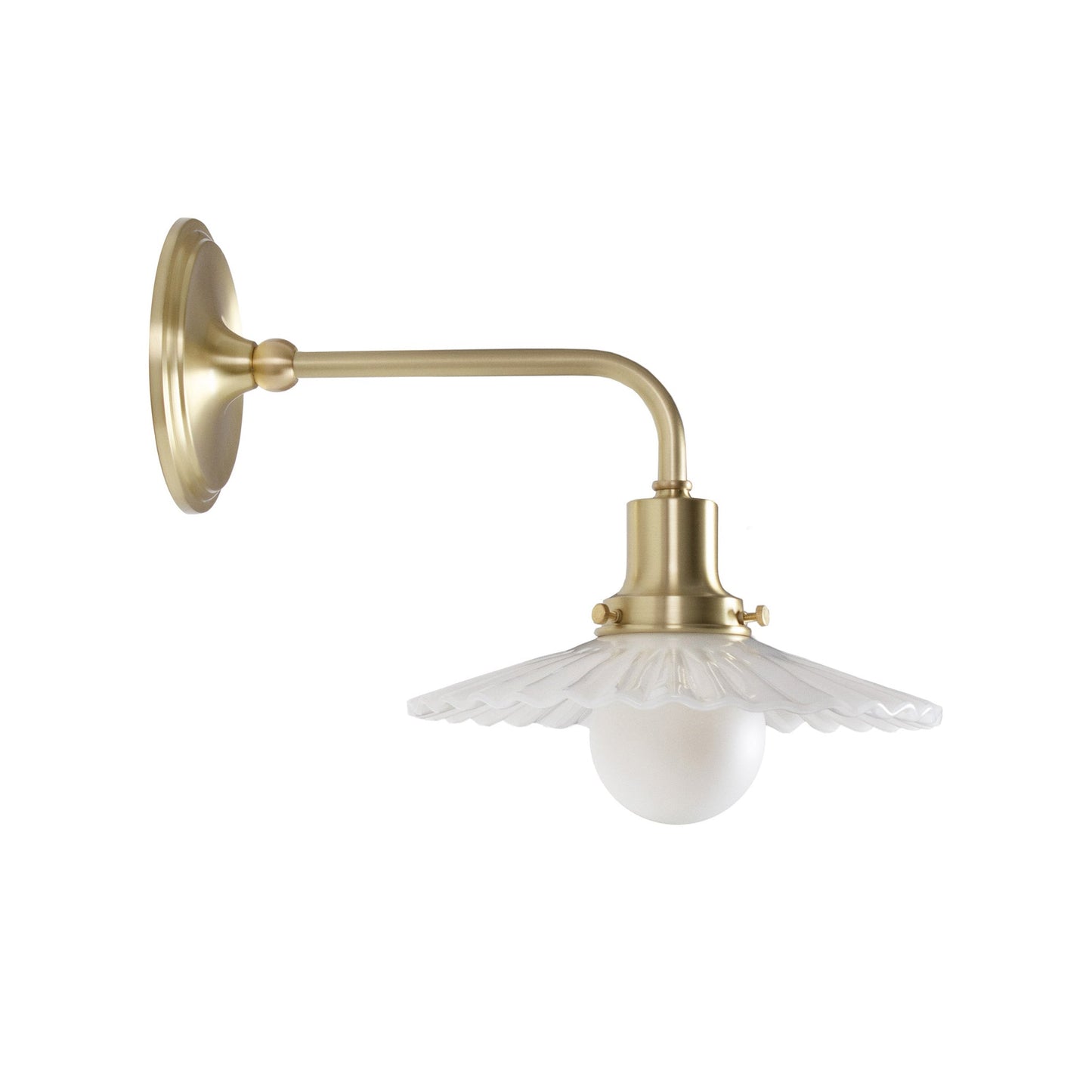 Marjorie Demi Sconce shown in Brass.